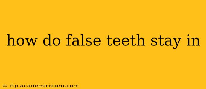 how do false teeth stay in