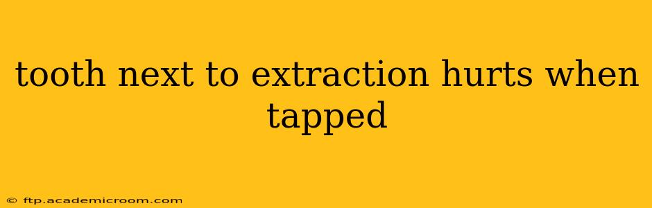 tooth next to extraction hurts when tapped